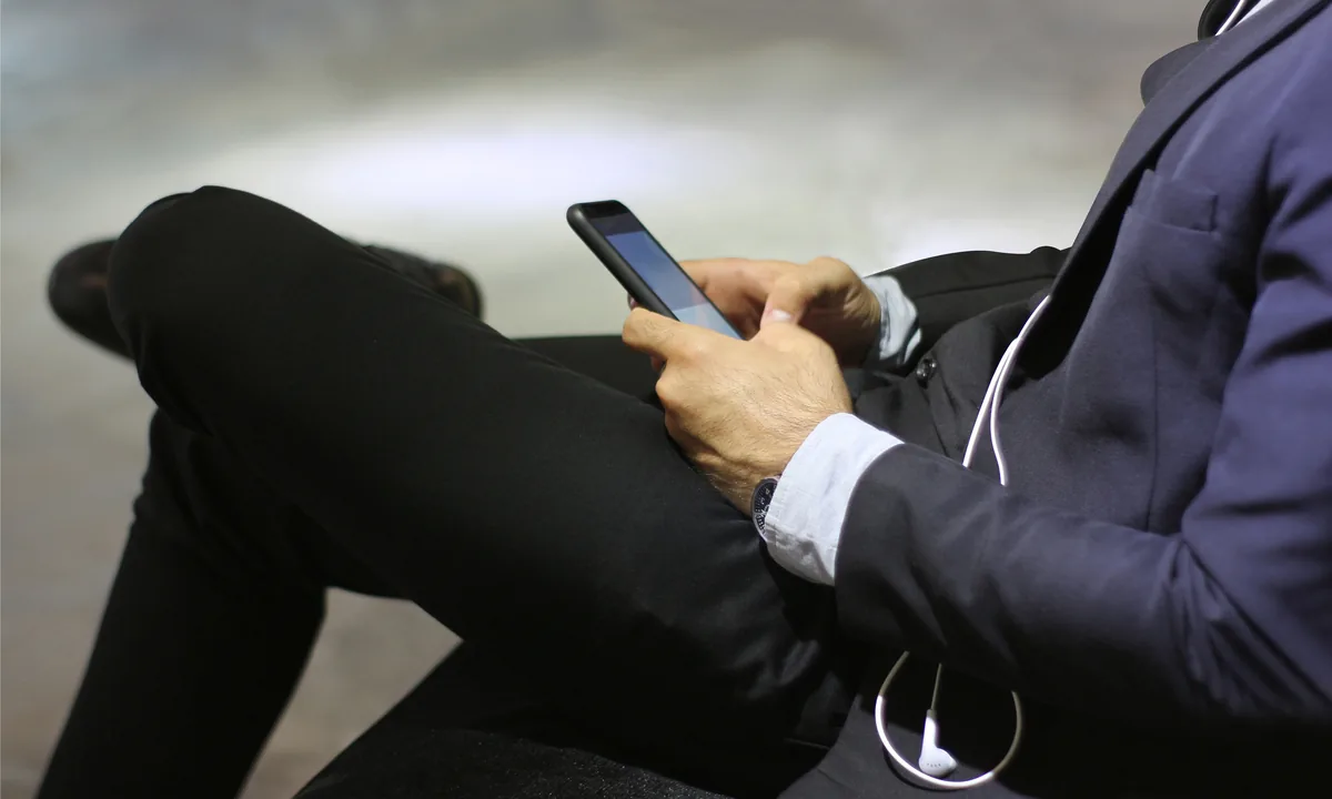 Man practicing with audio on his phone